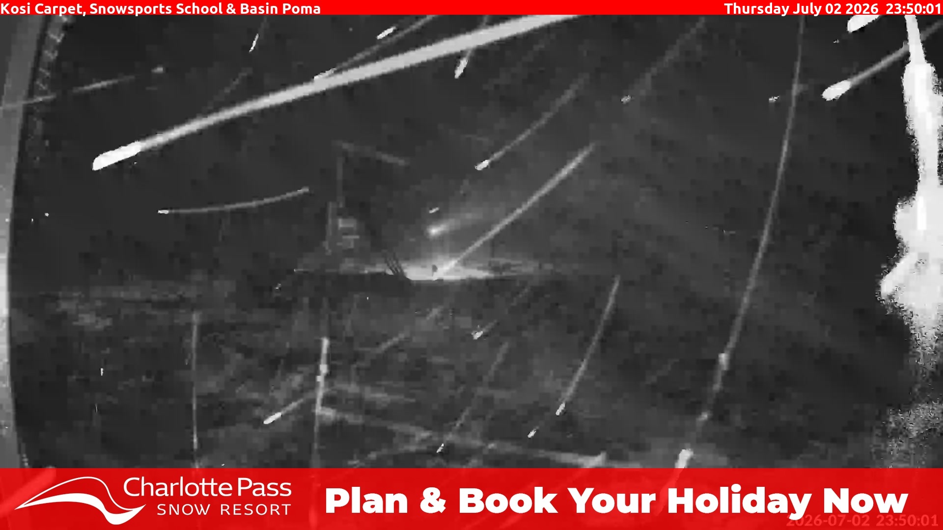 Charlotte Pass Kosi Carpet, Snowsports School and Basin Poma snow cam captured at 2 July 2026 at 11:54 pm AEST