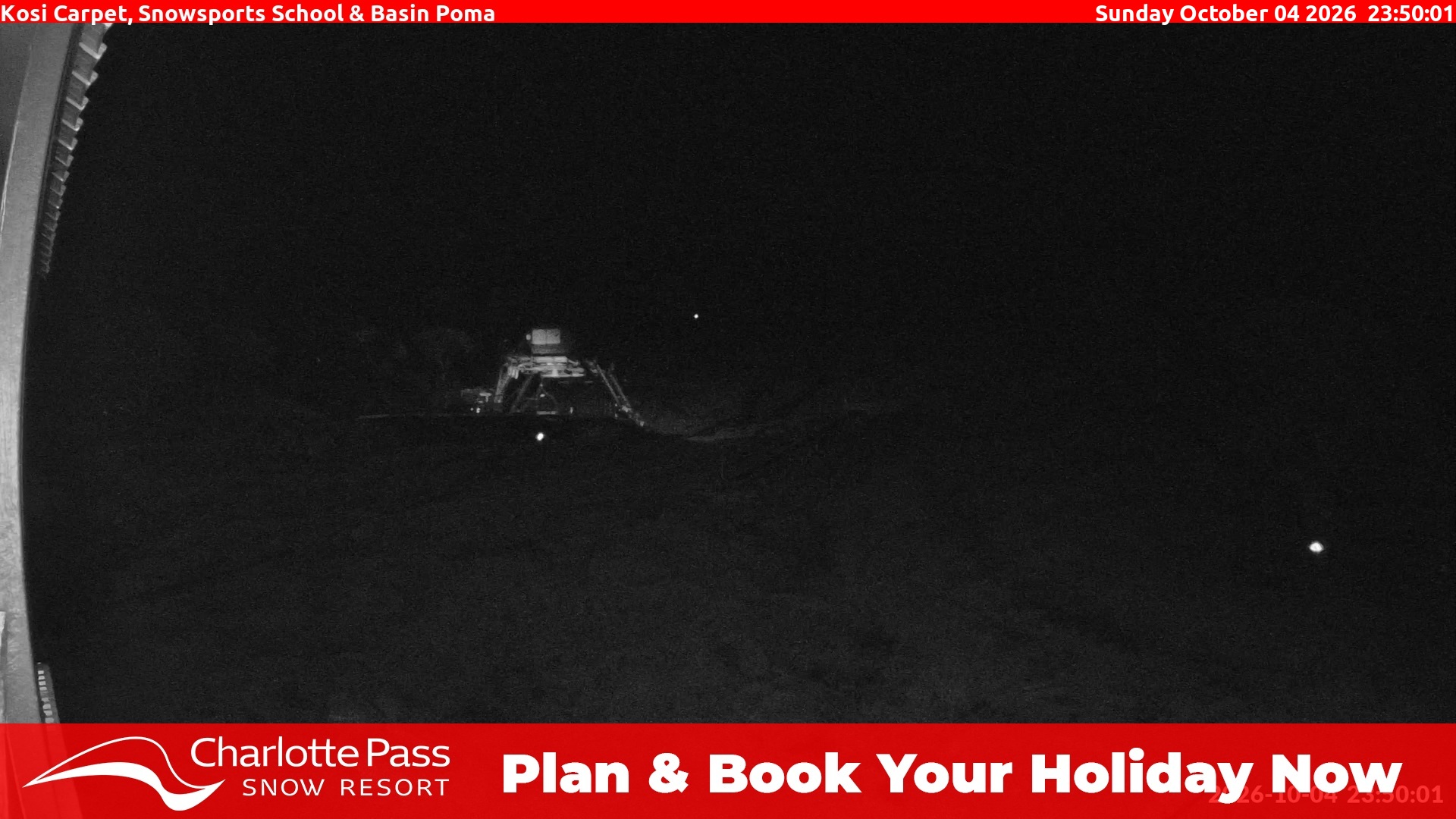 Charlotte Pass Kosi Carpet, Snowsports School and Basin Poma snow cam captured at 4 October 2026 at 11:55 pm AEDT